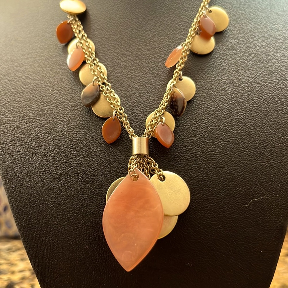 Coral blend of color necklace on a double gold tone chains.